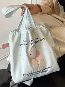 Light blue polka dot drawstring tote bag with cartoon bear embroidery and handles