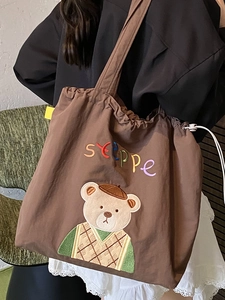 Fashionable brown canvas tote bag with bear embroidery and drawstring closure