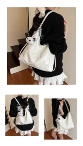 Three views of a white glossy patent leather tote bag with a cute panda plush charm