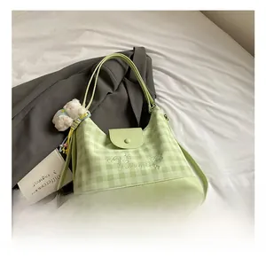 Detailed embroidery of Luckygirl heart on light green checkered fabric hobo bag
