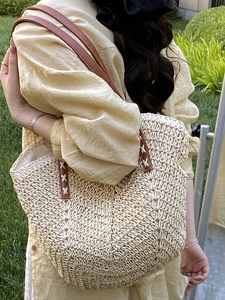 Large capacity woven straw tote bag with brown leather straps and cross-stitch detailing