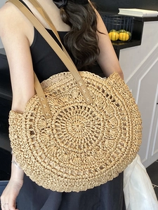 Minimalist straw woven tote bag with leather straps for women beach vacations