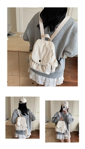 Cream canvas backpack for women showing flap cover and drawstring closure details