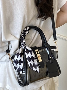 Fashionable transparent PVC bucket bag with black leather trim and checkered scarf handle