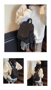 Detail showing the adjustable black nylon straps and drawstring closure on this mini backpack