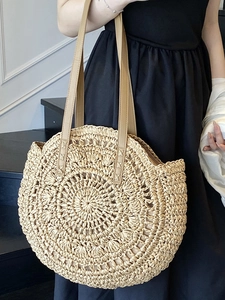 Chic round woven straw tote bag with leather straps for women beach vacations