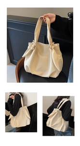Detail view of cream tote bag with stylish bow shoulder straps and high-capacity design