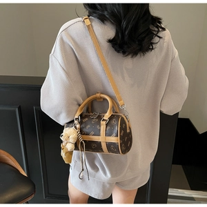 Mini Boston pillow bag in dark brown monogram faux leather with cute bear charm
