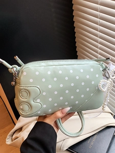 Mint green polka dot baguette bag with pearl bow charm and woven top handle for women