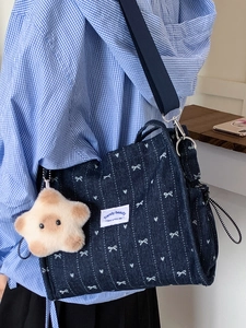Cute dark blue denim crossbody bag with white bow embroidery and plush star charm