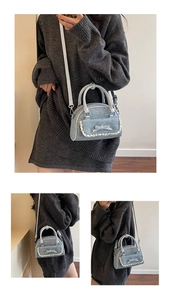 Close-up of light blue denim texture handbag with bow and white lace trim details