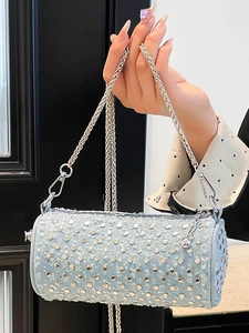 Light blue studded round crossbody bag with silver chain strap for summer 2025