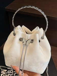 Chic white faux suede bucket bag with silver butterfly drawstring and metal ring handle