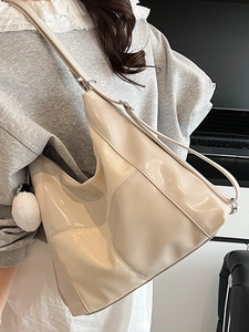 Cream large capacity hobo shoulder bag with glossy finish and white plush charm pendant