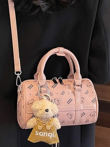 Fashionable pink cylinder Boston bag with cartoon bear prints and plush pendant
