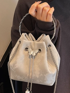 Silver grey velvet bucket bag with metal ring handle and pearl butterfly charm