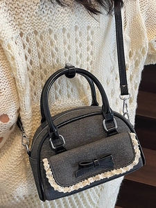 Chic grey bow handbag with lace trim and black leather handles for summer fashion