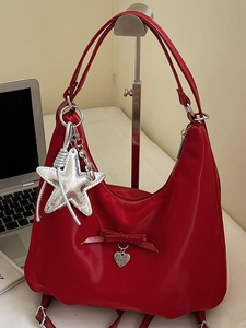 Chic red nylon dumpling shoulder bag with silver star charm and bow decoration