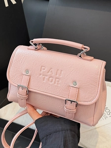 Pink lychee grain leather mini crossbody bag with embossed logo and silver buckle strap