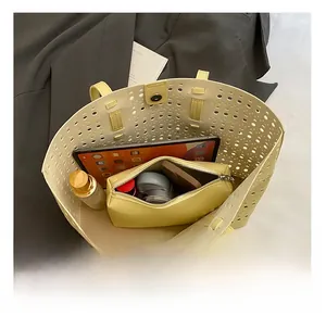 Internal view of hollow out tote bag showing large capacity and inner pouch