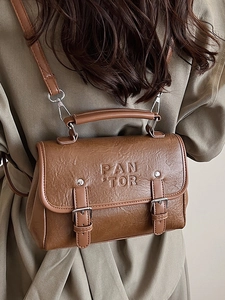 Retro brown PU leather satchel with PAN TOR lettering and adjustable shoulder strap