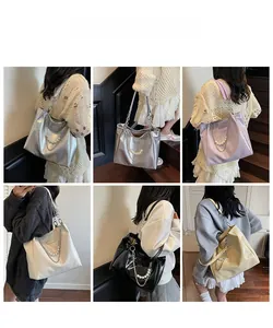 Detail shot of stylish tote bags in five colors with decorative pearl and metal chains