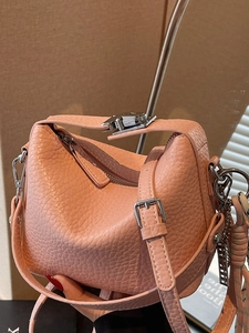 Pink lychee grain leather tote bag with silver hardware and adjustable shoulder strap