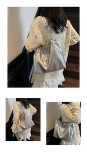 Detail of silver tote bag with metallic crinkle texture, pearl chain and metal strap