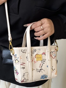 Mini sac seau en toile avec graffitis de dessins animés et bandoulière amovible