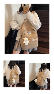 Detail view of khaki canvas backpack featuring a plush bear charm and waswac rules patch