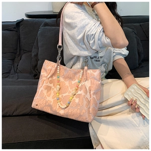 Pink heart-pattern tote bag with macaron bead charm and silver chain strap detail