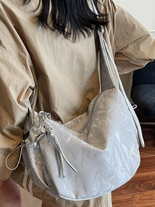 Silver metallic hobo bag with large capacity and heart pendant for women commute