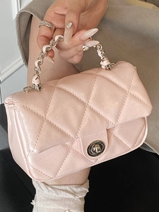 Pink quilted shoulder bag with glitter finish and silver twist lock for elegant women