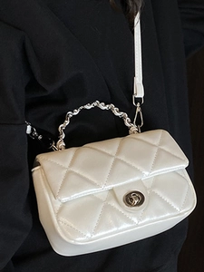 White quilted crossbody bag with diamond pattern and metal handle for women