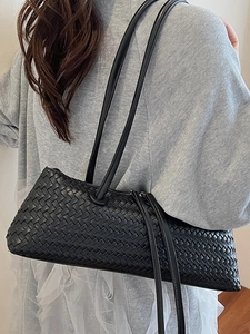 Elegant black woven leather shoulder bag with sleek east-west design and dual straps