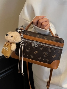 Vintage brown box bag with bear pattern, top handle, and cute plush bear charm for women