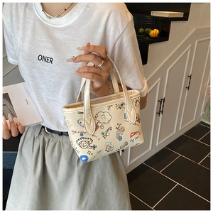 Detail of the cute graffiti canvas tote bag showing colorful cloud and rainbow prints