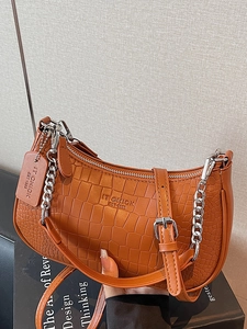 Brown faux-crocodile baguette bag with silver chain and adjustable shoulder strap