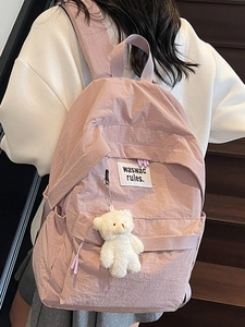 Pink aesthetic school backpack with plush bear pendant for college students