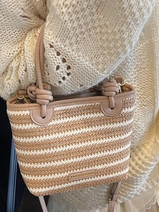 Bohemian striped woven straw tote bag with pink leather handles and knot details