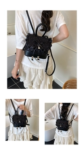 Detail of black mini lace backpack featuring ruffle edges and a decorative pearl bow
