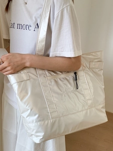 Pearlescent white waterproof gym tote bag with wide shoulder straps and embroidery