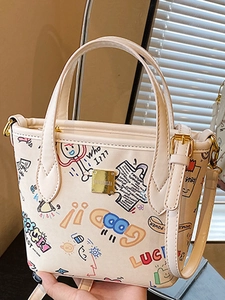 Cute cartoon graffiti cream tote bag with adjustable shoulder strap and gold logo