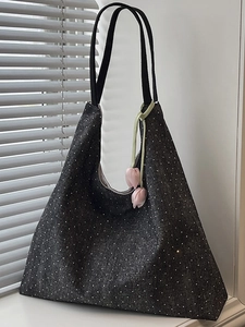 Deep grey denim tote bag with white polka dots and a pink tulip pendant accessory