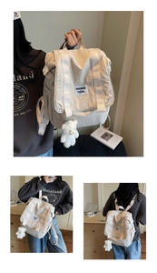 Detail view of cream canvas backpack with flap closure and cute plush bear accessory