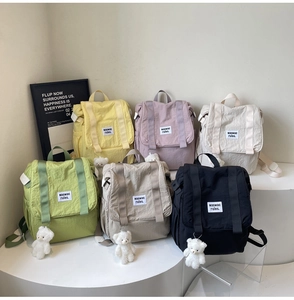 Detailed display of lightweight nylon backpacks in six soft colors with plush bear charms