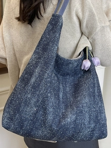 Minimalist navy blue denim tote bag with fine polka dots and spacious shoulder design