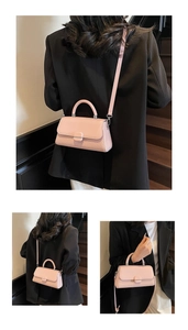 Detail view of pink crossbody bag with twill pattern texture and metallic magnetic buckle