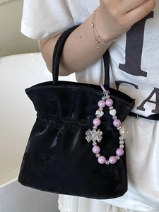 Exquisite black velvet pleated bucket bag with decorative purple beaded pendant charm