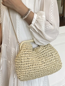 Minimalist beige woven straw frame bag with gold chain strap for summer beach vacation